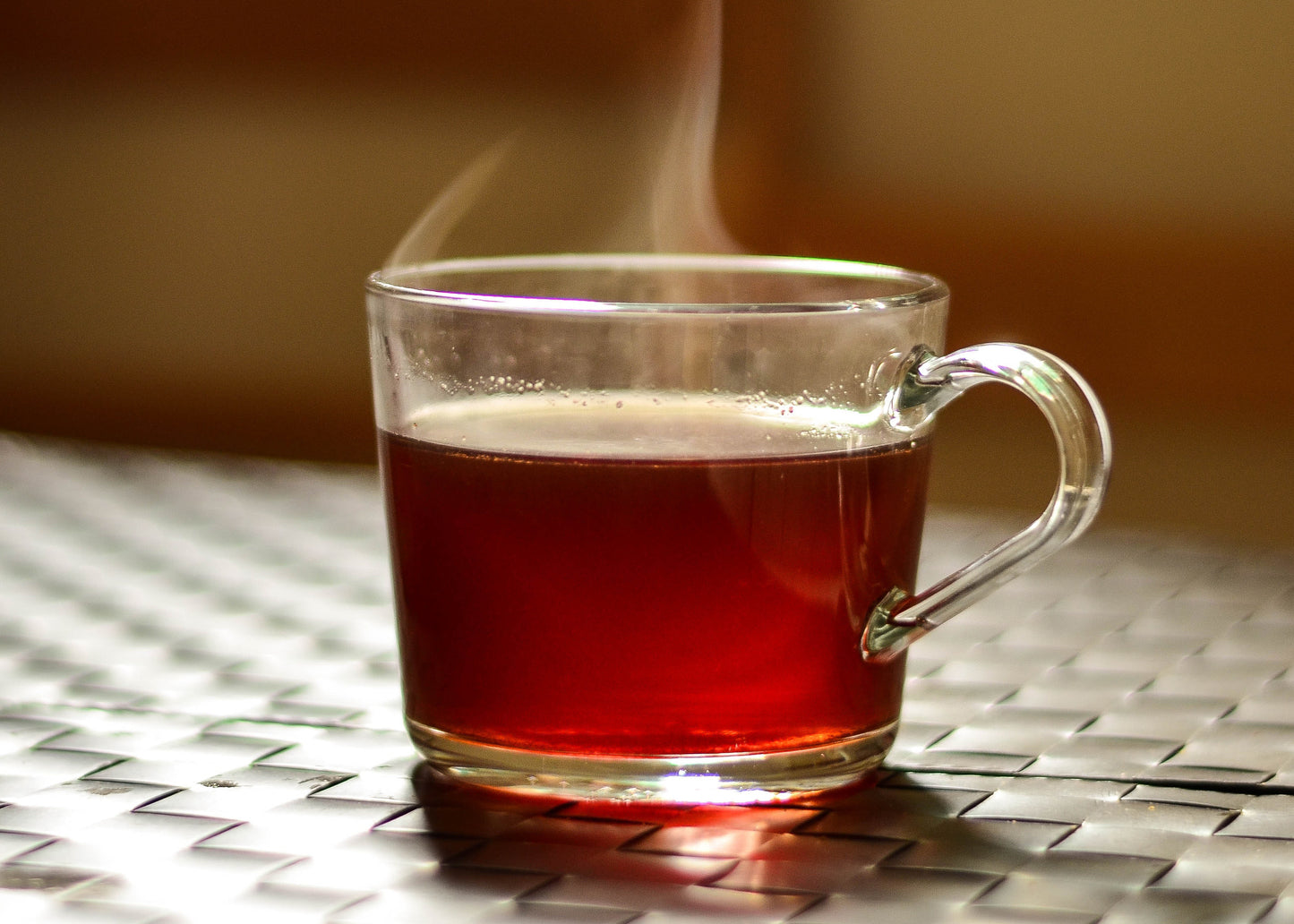 Kohana coffee hot toddy in a glass on a table 